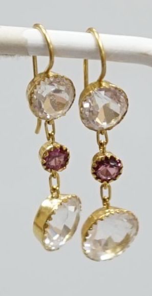 A pair of yellow metal, rock crystal and garnet? set three stone drop earrings, overall 37mm, gross 3.1 grams.